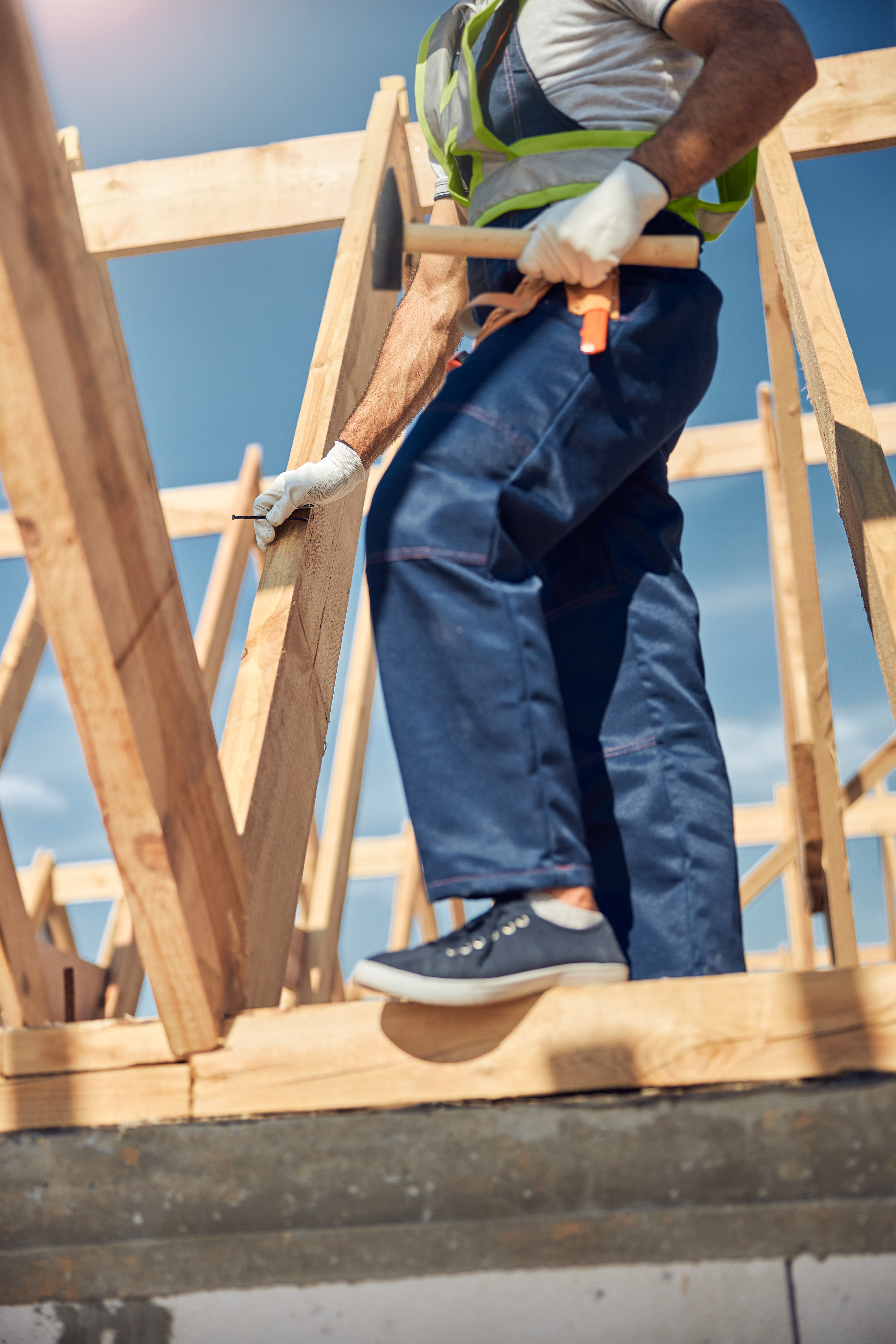 Profile photo of strong man that standing on the beam